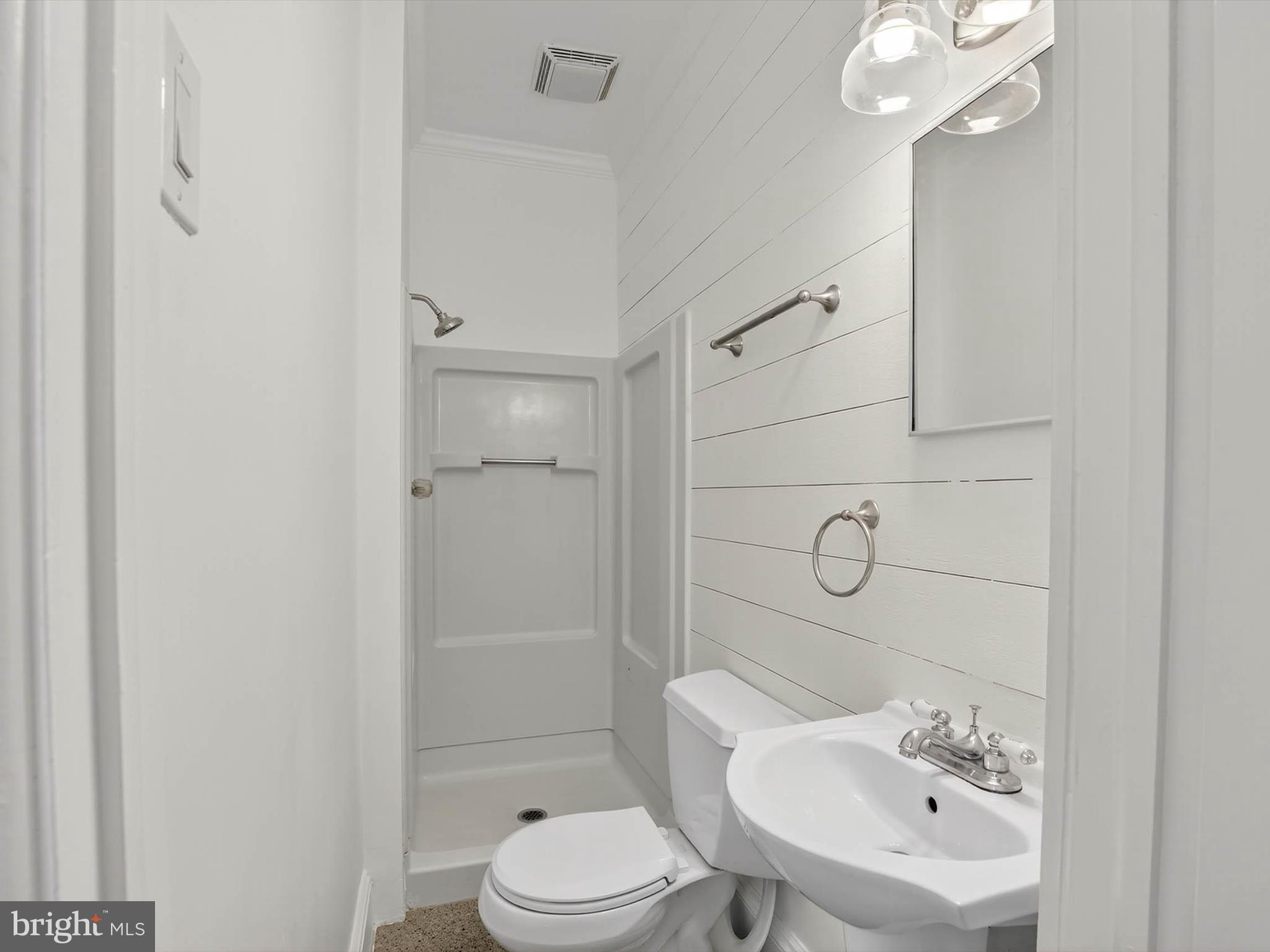 5334 Strasburg Road Kinzers, PA 17535 - Photo 17 of 44 a bathroom with a sink toilet and shower