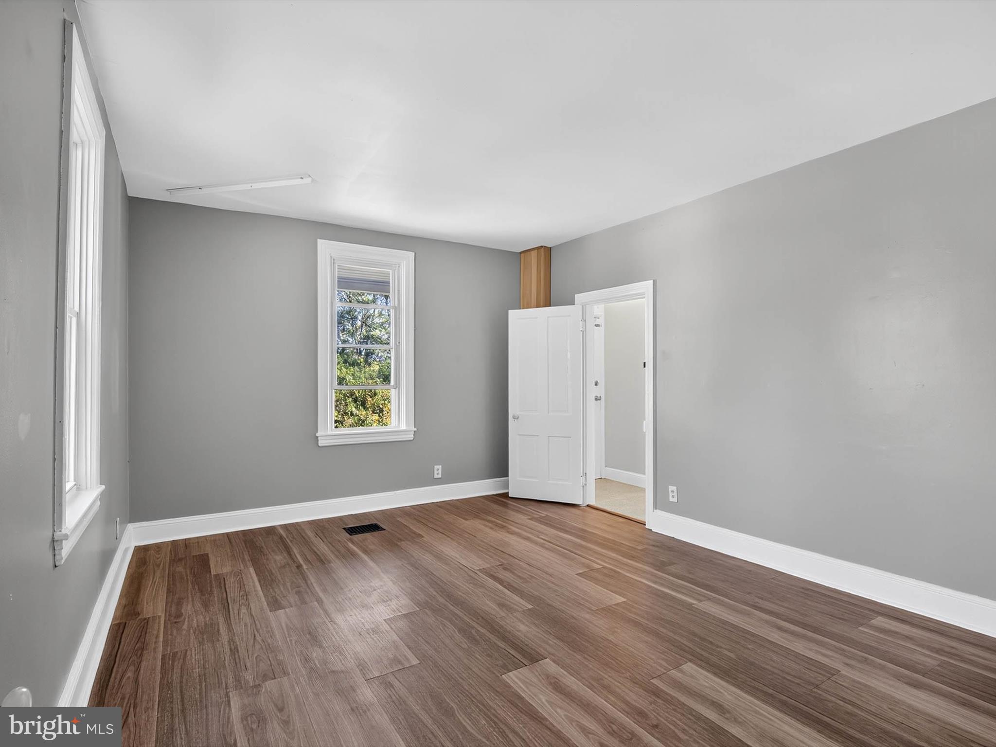 5334 Strasburg Road Kinzers, PA 17535 - Photo 20 of 44 an empty room with wooden floor and windows