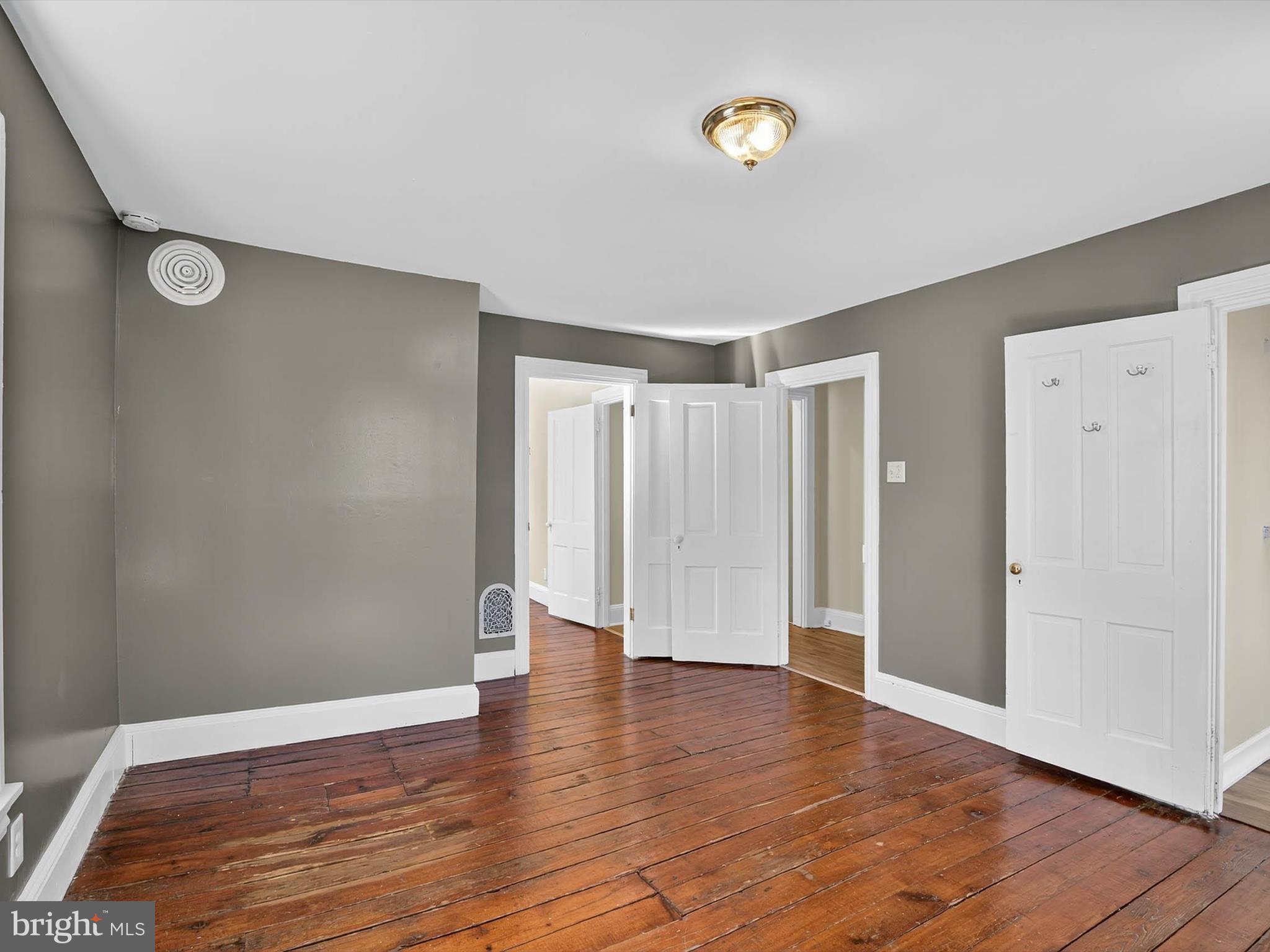 5334 Strasburg Road Kinzers, PA 17535 - Photo 28 of 44 a view of an empty room with wooden floor and a window