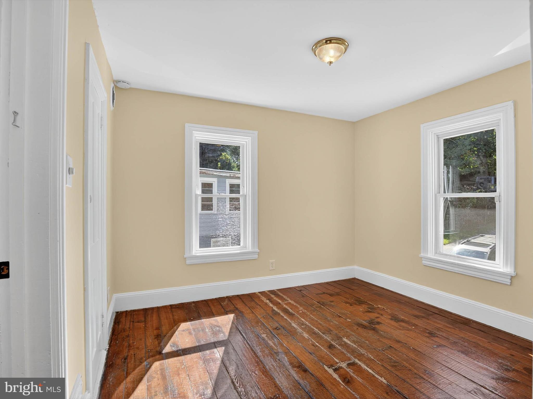 5334 Strasburg Road Kinzers, PA 17535 - Photo 31 of 44 a view of an empty room with wooden floor and a window