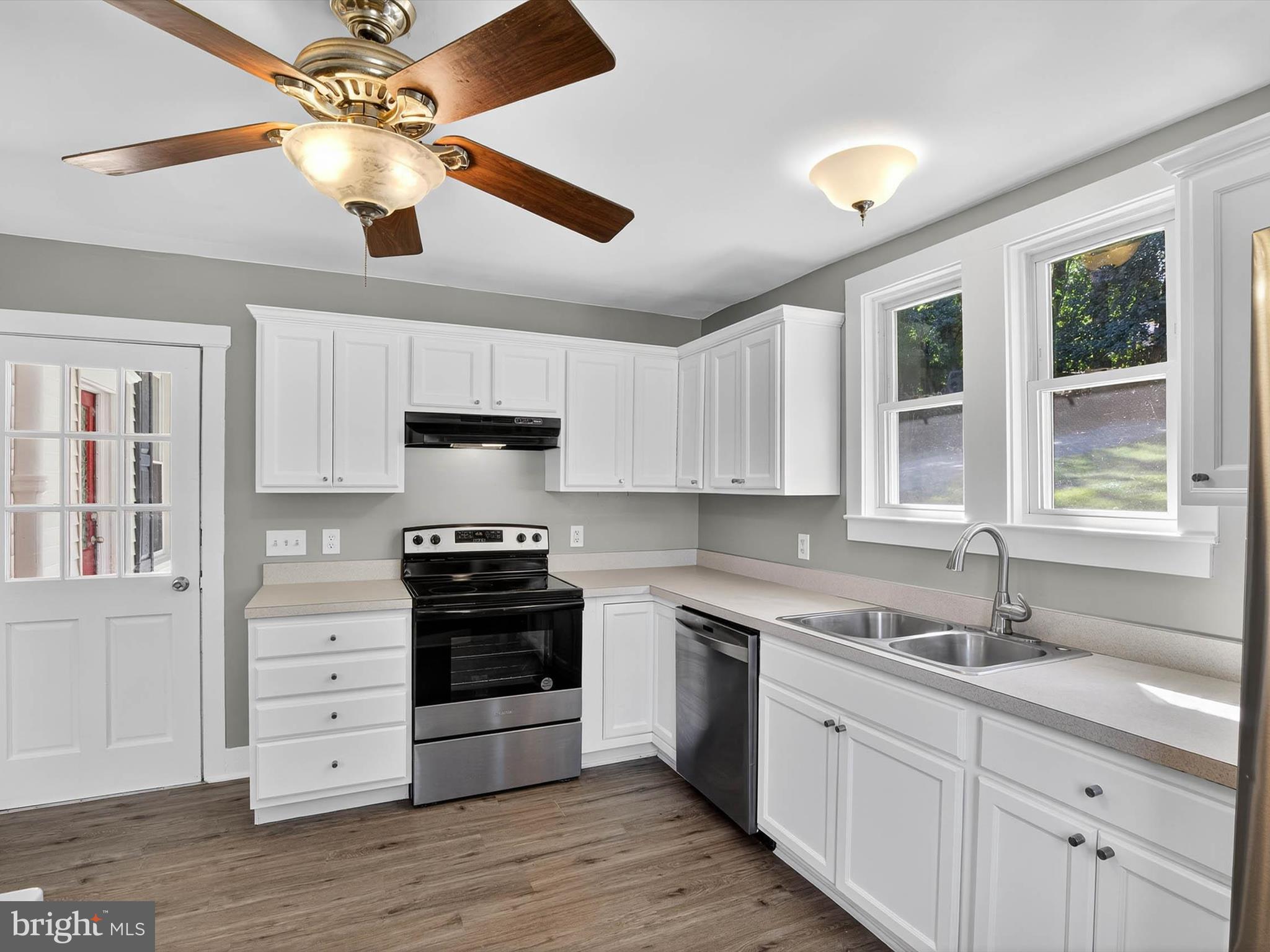 5334 Strasburg Road Kinzers, PA 17535 - Photo 6 of 44 a kitchen with stainless steel appliances a stove sink and cabinets