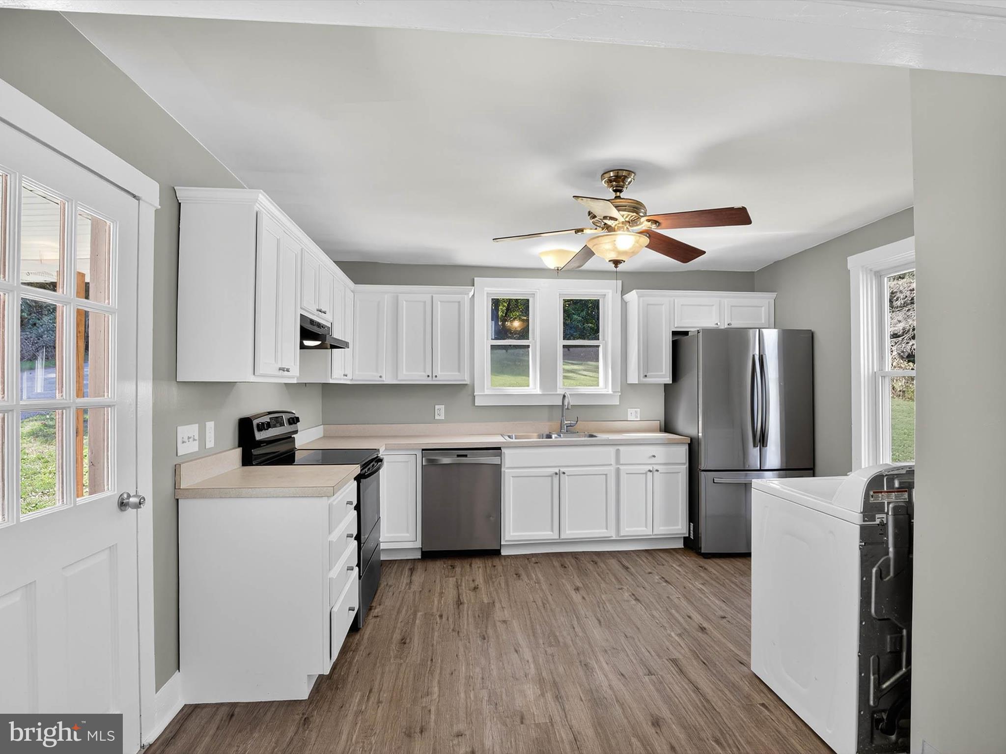 5334 Strasburg Road Kinzers, PA 17535 - Photo 9 of 44 a kitchen with refrigerator cabinets and wooden floor