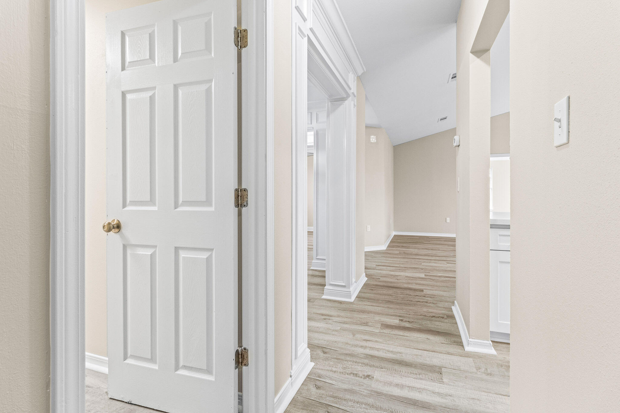 230 Beacon Way Santa Rosa Beach, FL 32459 - Photo 24 of 46 a view of a hallway with wooden floor and entryway