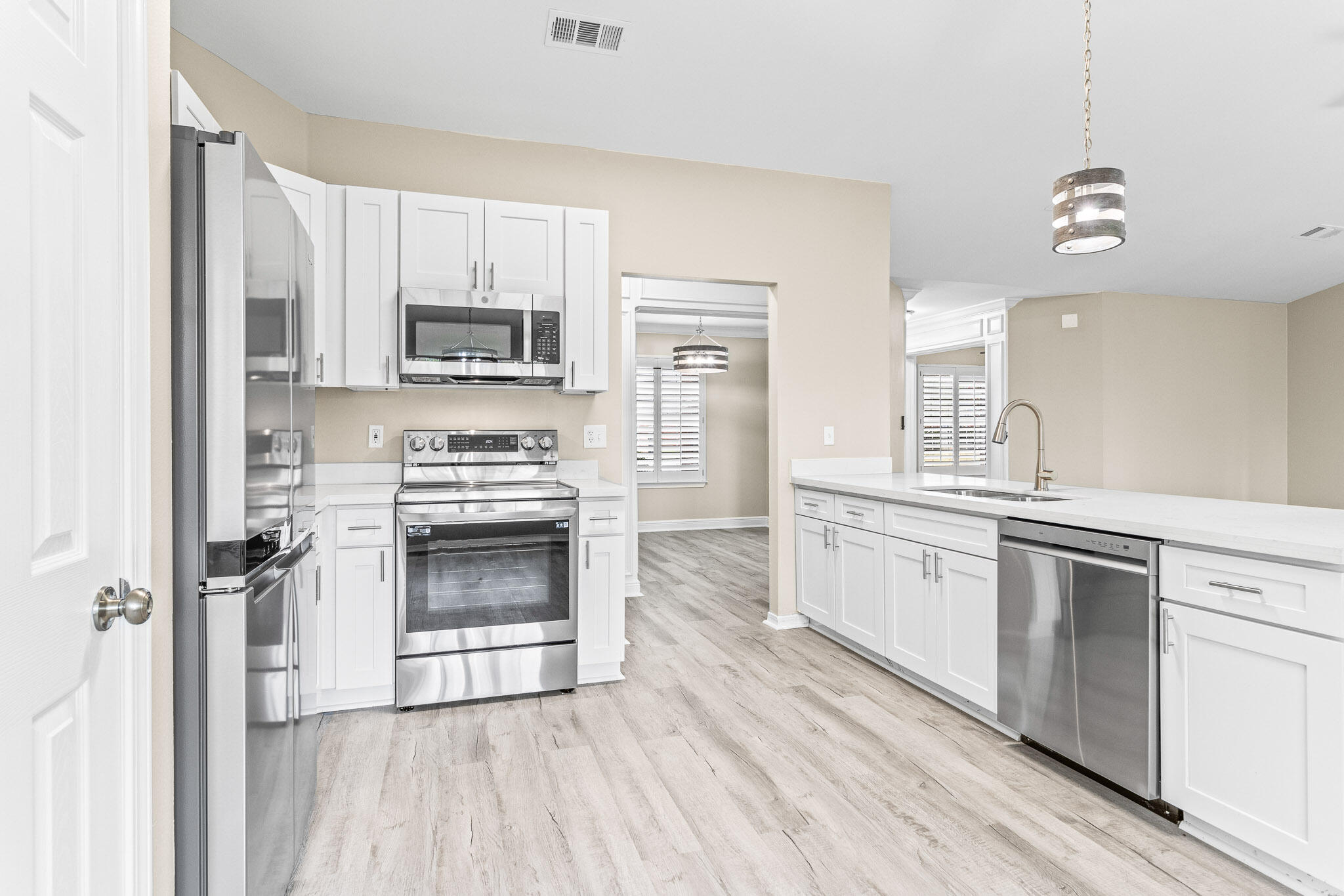 230 Beacon Way Santa Rosa Beach, FL 32459 - Photo 27 of 46 a kitchen with a stove a sink and a microwave