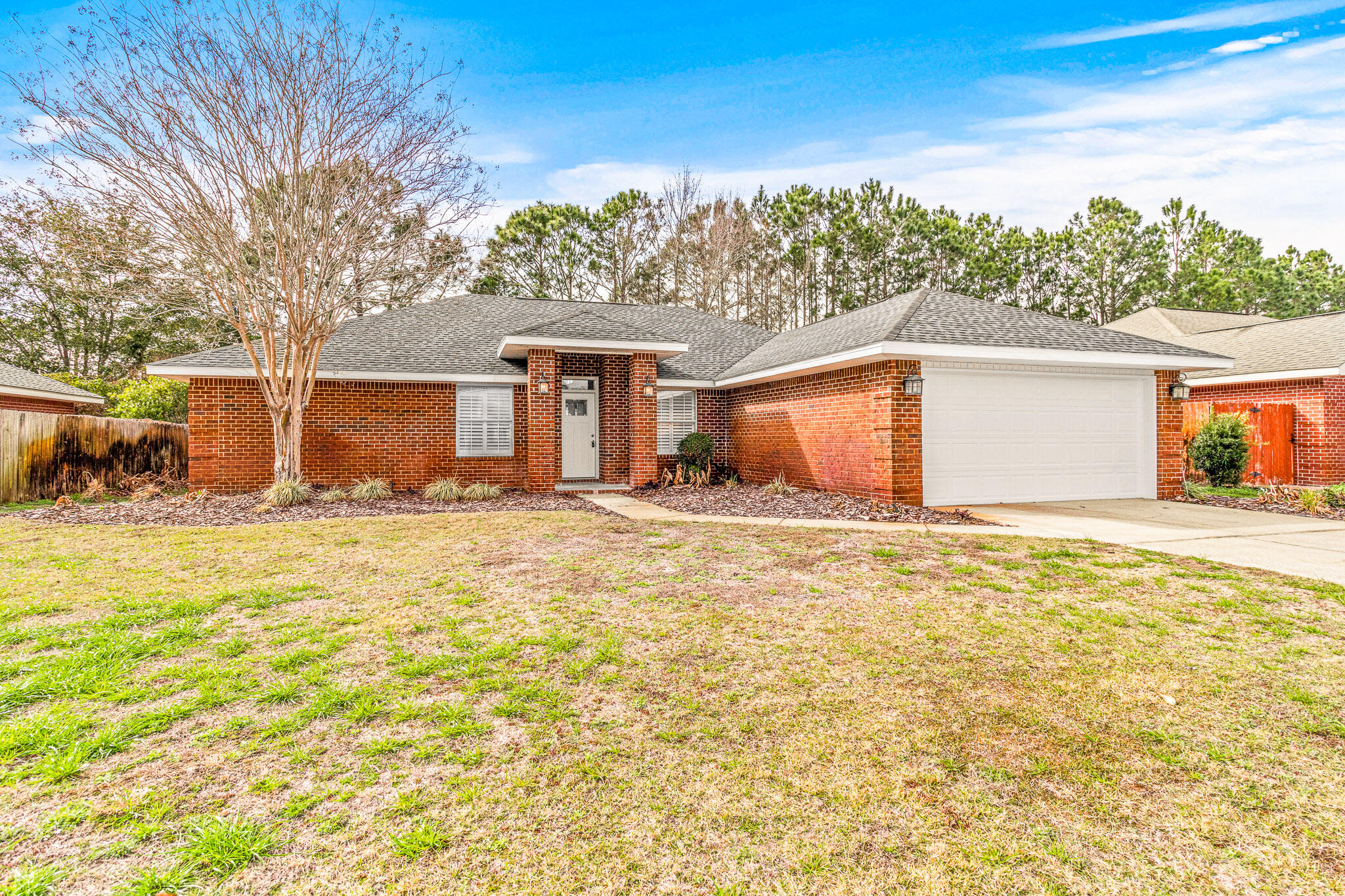 230 Beacon Way Santa Rosa Beach, FL 32459 - Photo 3 of 46 a front view of a house with a yard