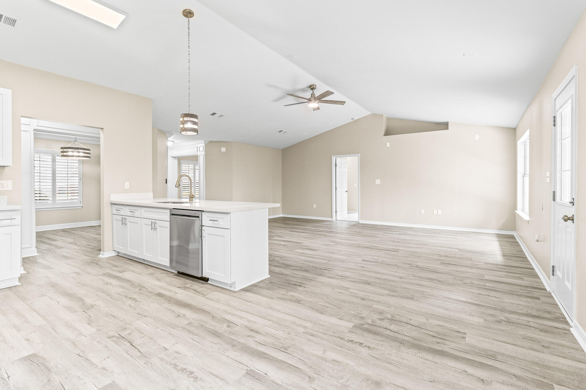 230 Beacon Way Santa Rosa Beach, FL 32459 - Photo 31 of 46 a view of a kitchen with a sink cabinets and wooden floor