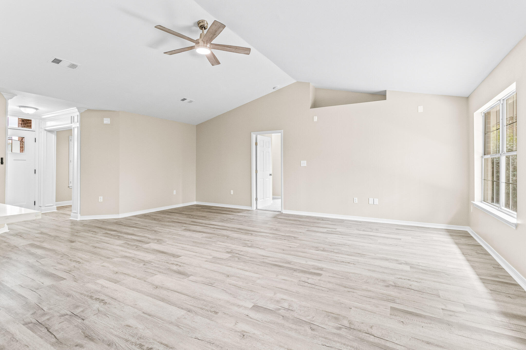 230 Beacon Way Santa Rosa Beach, FL 32459 - Photo 32 of 46 wooden floor in an empty room with a window