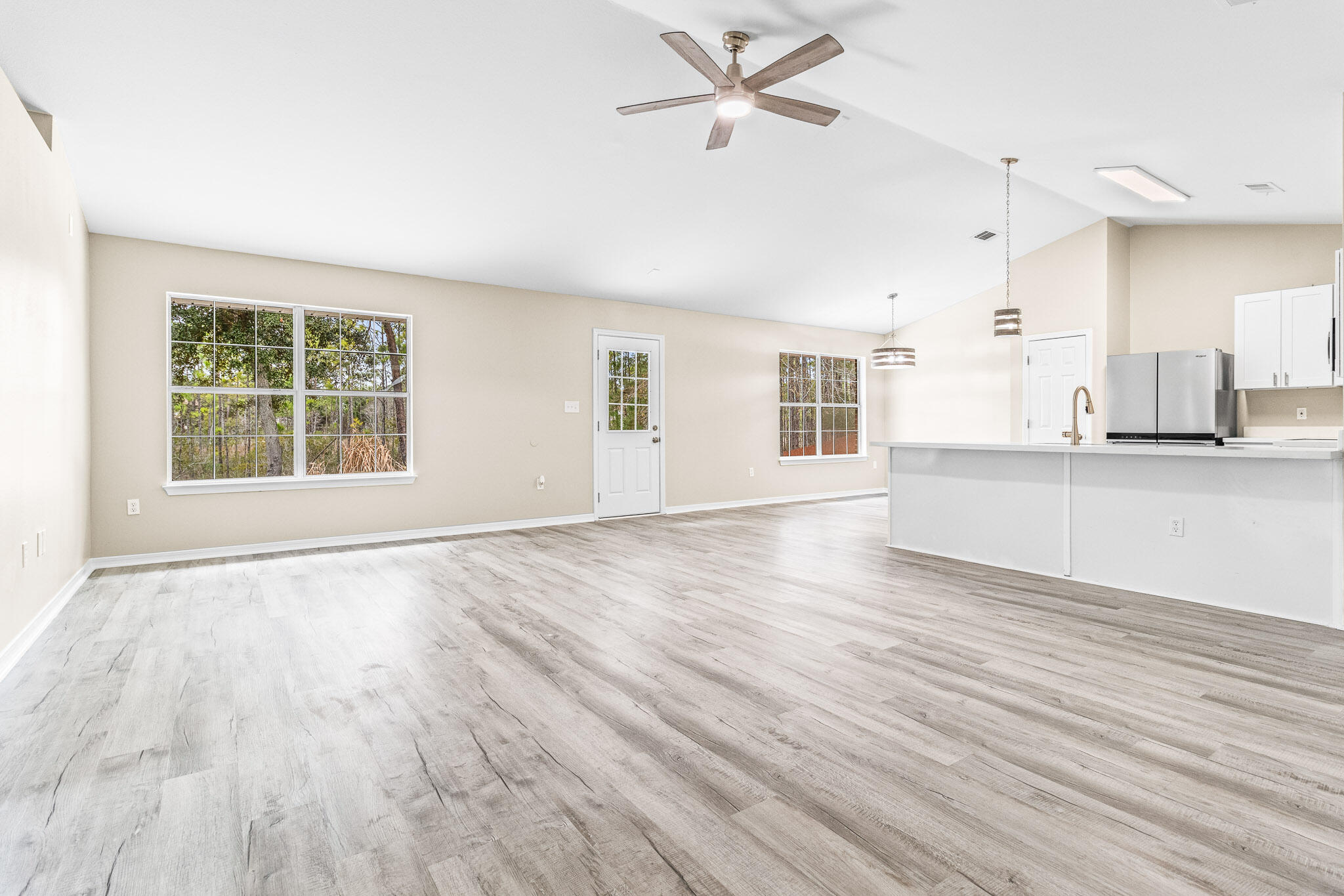 230 Beacon Way Santa Rosa Beach, FL 32459 - Photo 34 of 46 a view of a kitchen with wooden floor and a window