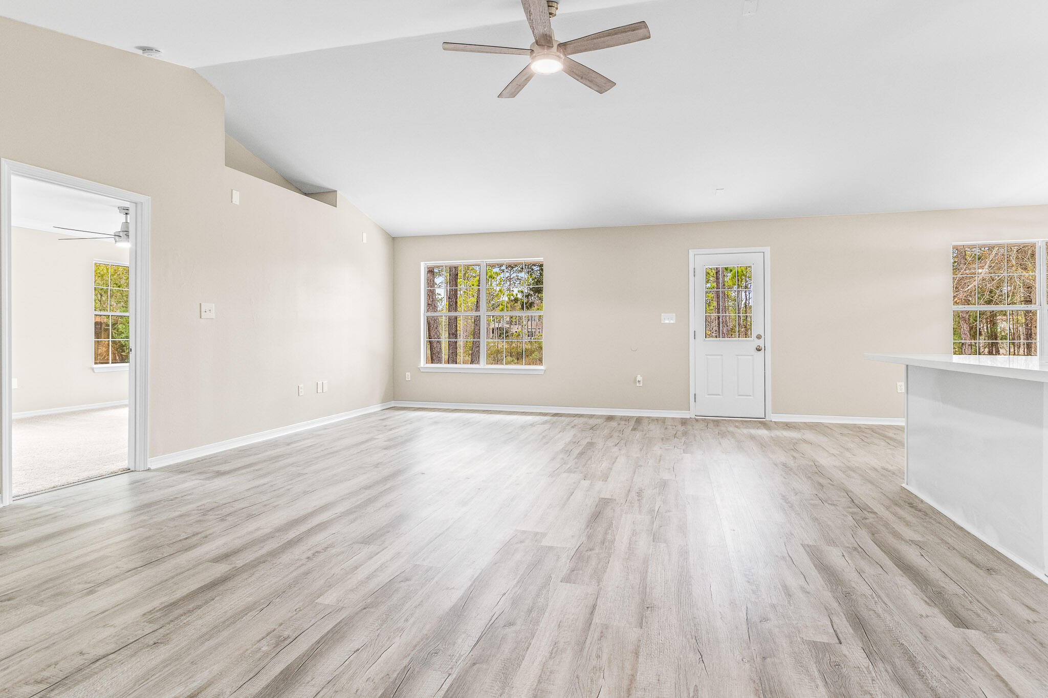 230 Beacon Way Santa Rosa Beach, FL 32459 - Photo 35 of 46 an empty room with wooden floor and windows