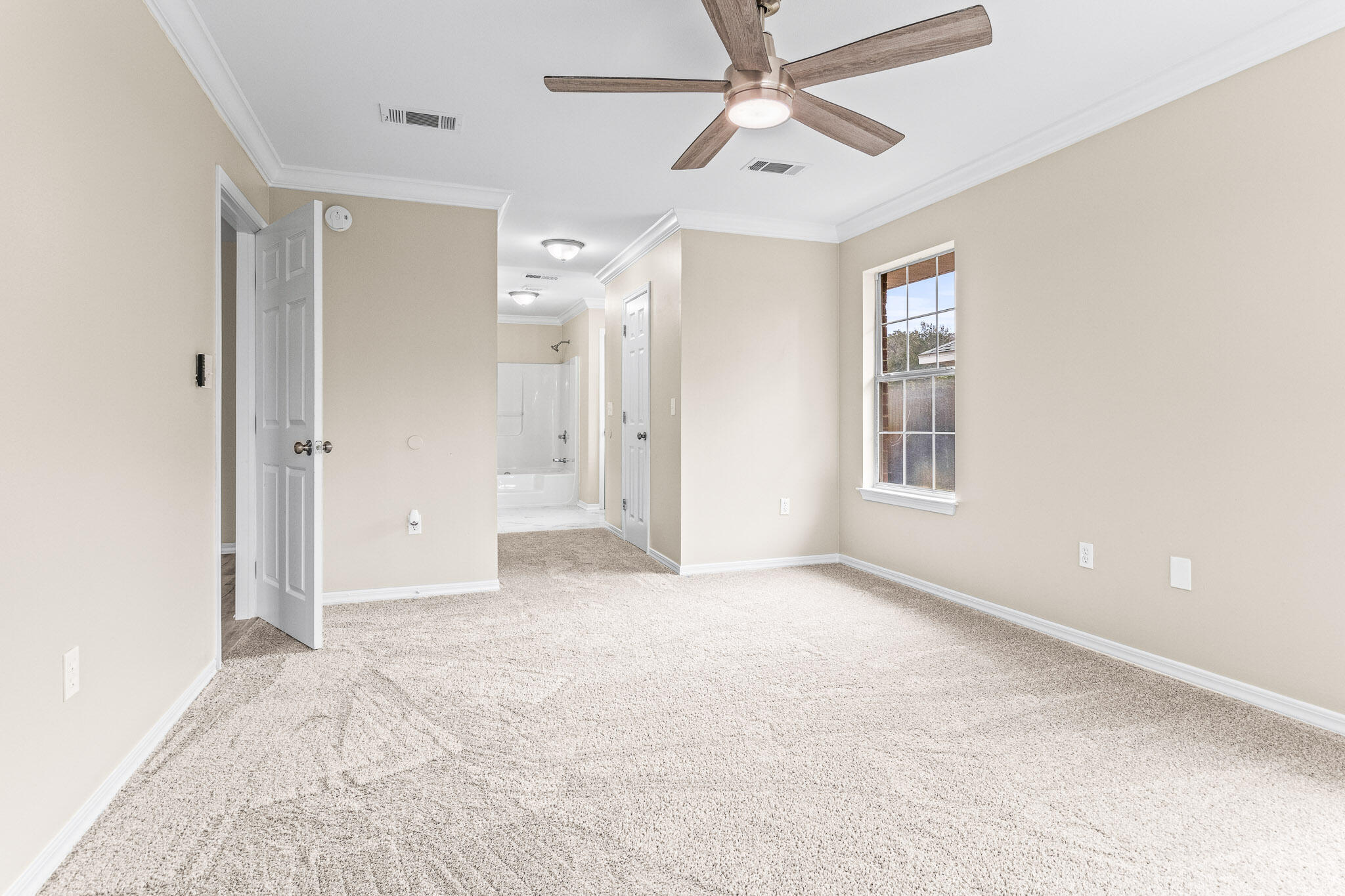 230 Beacon Way Santa Rosa Beach, FL 32459 - Photo 38 of 46 an empty room with chandelier fan and windows