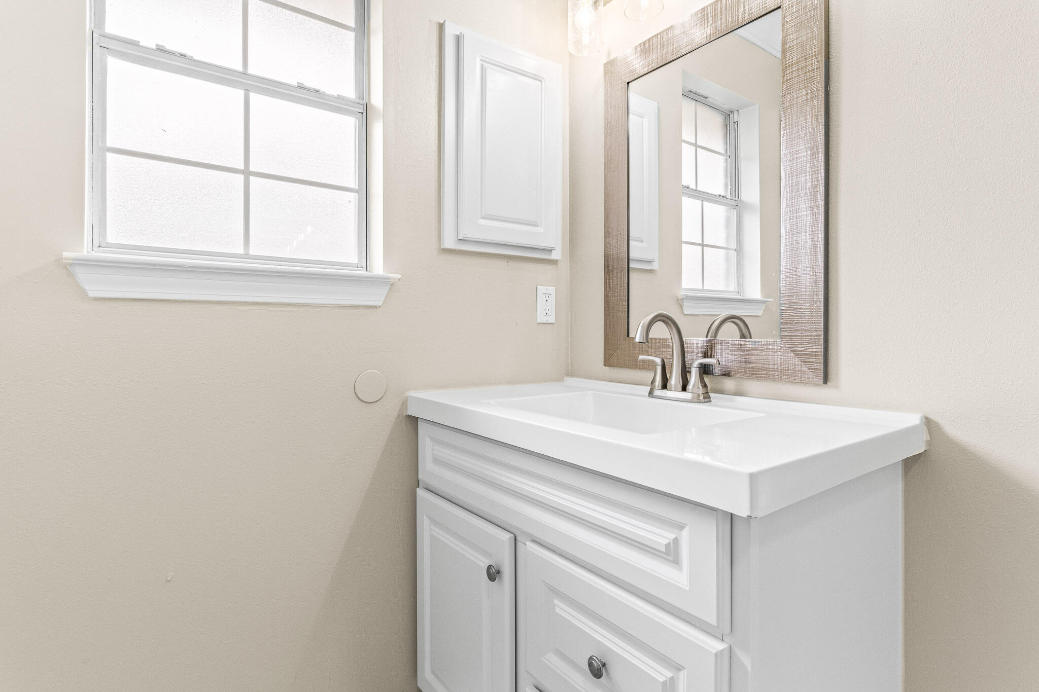 230 Beacon Way Santa Rosa Beach, FL 32459 - Photo 42 of 46 a bathroom with a sink a vanity and a window