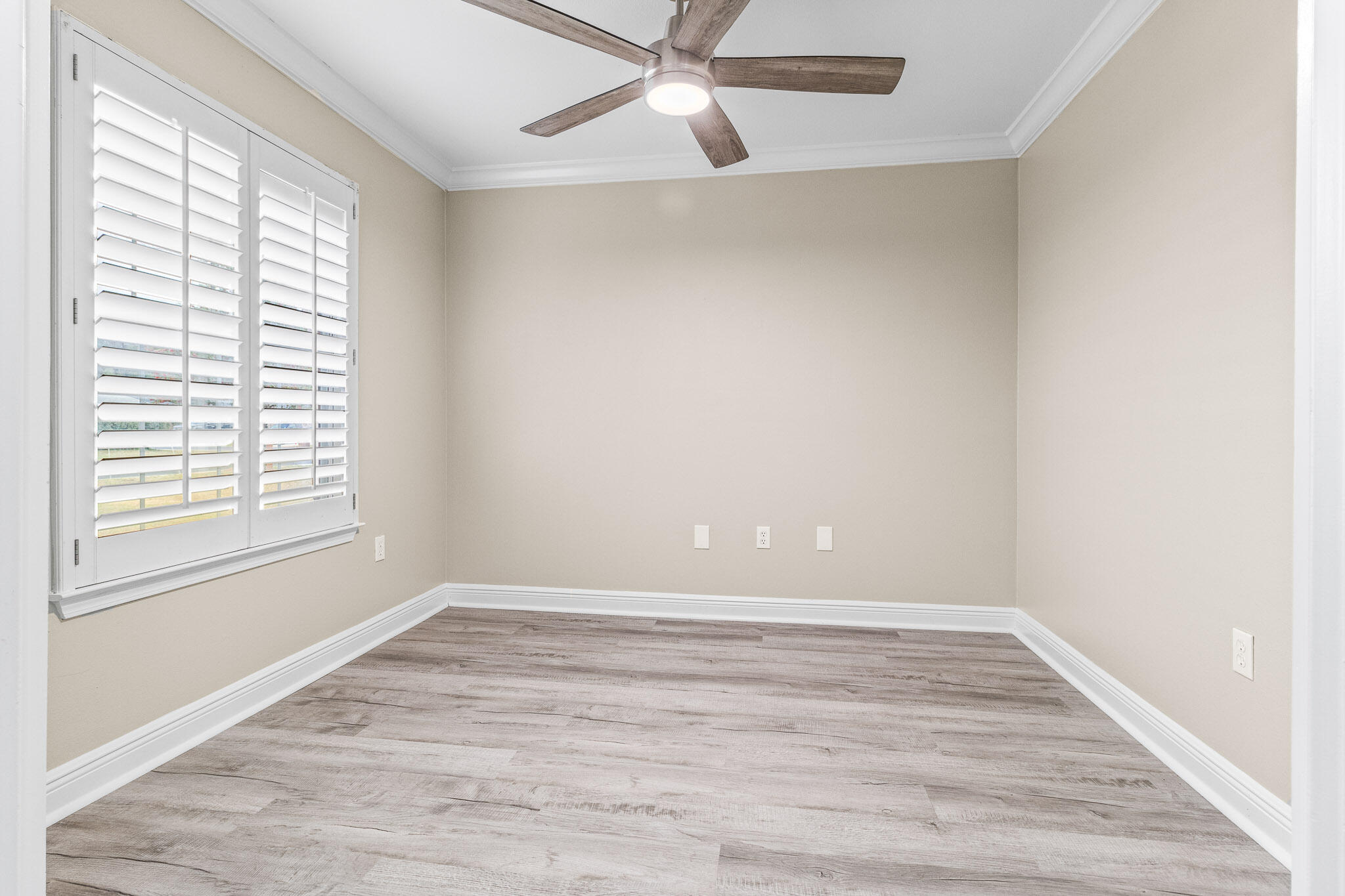 230 Beacon Way Santa Rosa Beach, FL 32459 - Photo 6 of 46 an empty room with wooden floor and windows