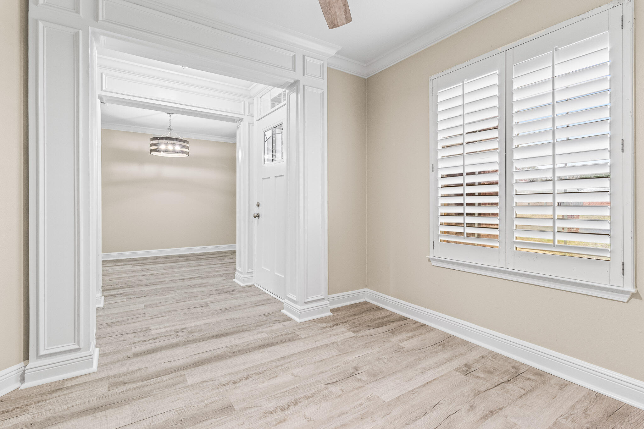 230 Beacon Way Santa Rosa Beach, FL 32459 - Photo 8 of 46 a view of an empty room with wooden floor and a window