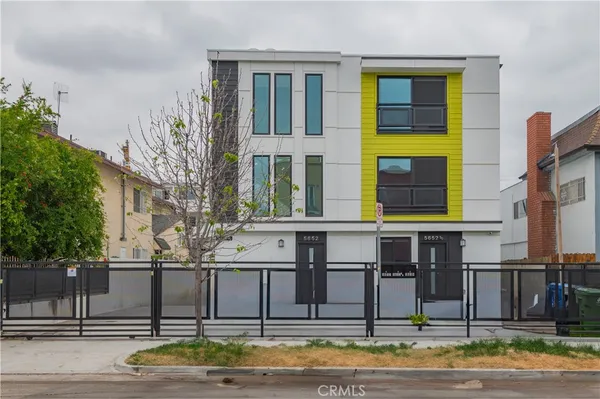 a front view of building with street