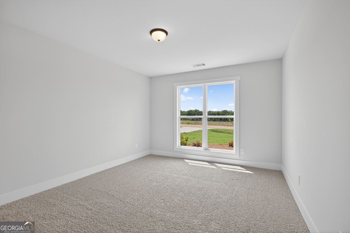 206 Airport Road, Unit 11 Canon, GA 30520 - Photo 27 of 34 a view of an empty room with a window