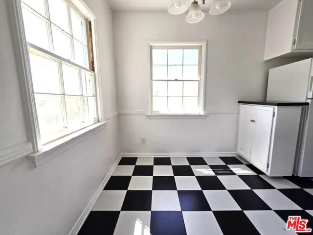 a kitchen with a cabinets and a stove