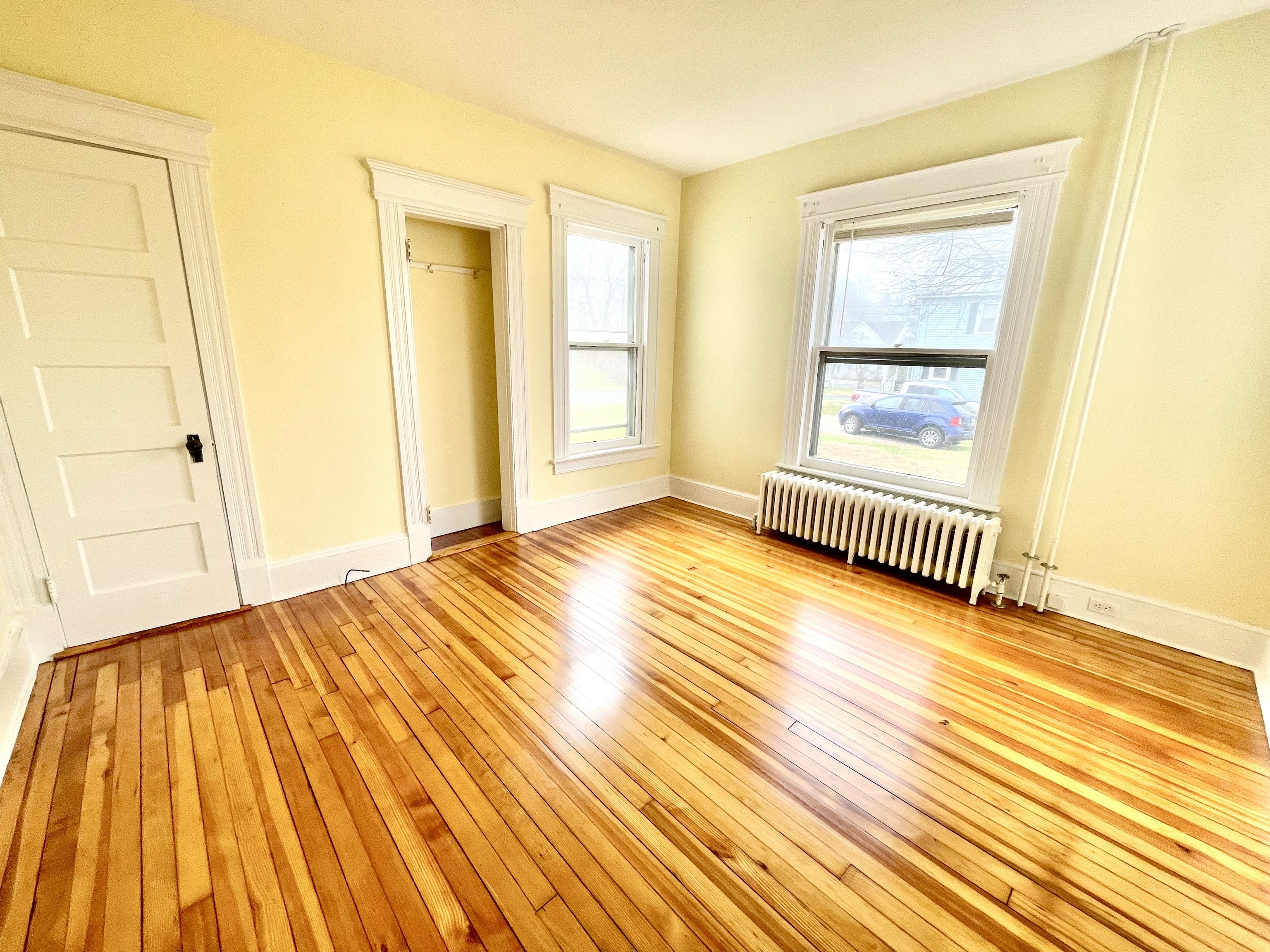 22 Upson Avenue Winchester, CT 06098 - Photo 9 of 10 a bedroom with a bed and wooden floor