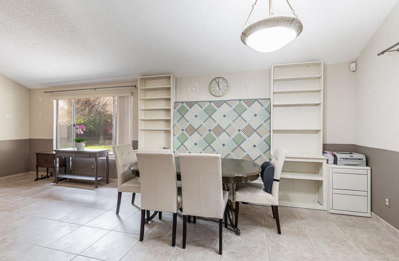 6549 North Cornelia Avenue Fresno, CA 93722 - Photo 17 of 30 a view of a workspace with furniture and a window
