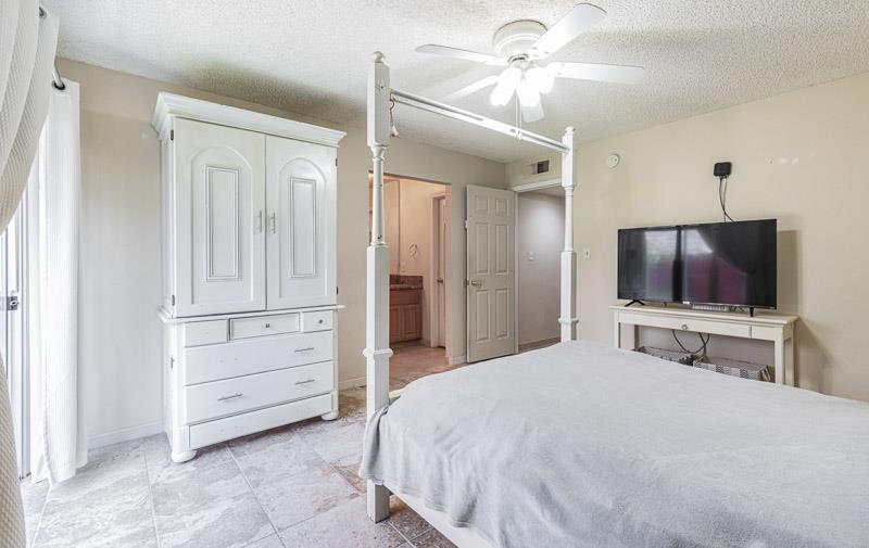 6549 North Cornelia Avenue Fresno, CA 93722 - Photo 25 of 30 a bedroom with a bed and a flat screen tv