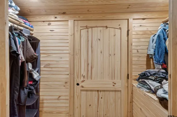 a view of a hallway with washer and dryer