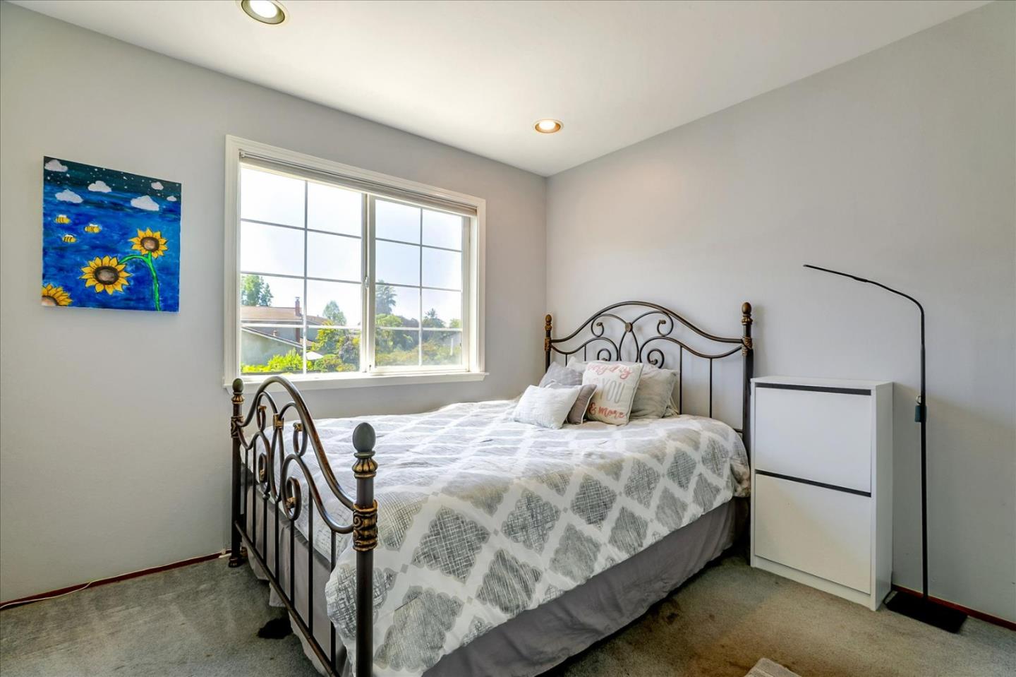 7166 Brooktree Way San Jose, CA 95120 - Photo 18 of 48 a bedroom with a bed and a large window