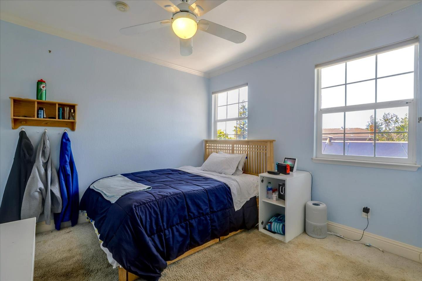 7166 Brooktree Way San Jose, CA 95120 - Photo 22 of 48 a bedroom with a bed and a window