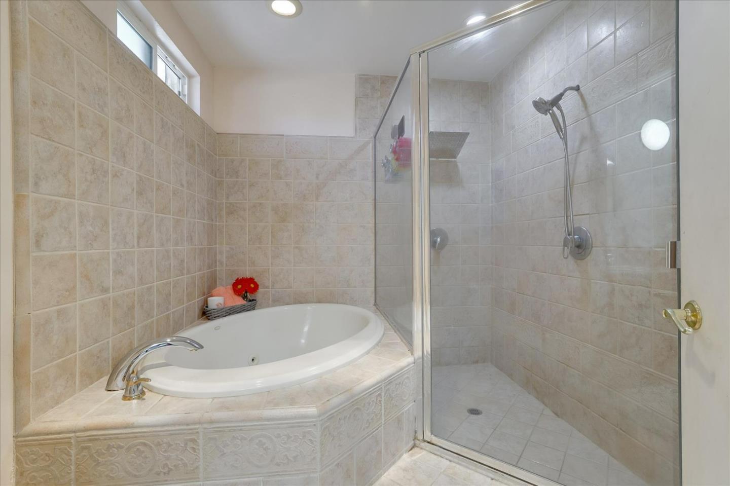 7166 Brooktree Way San Jose, CA 95120 - Photo 29 of 48 a bathroom with a tub and a shower