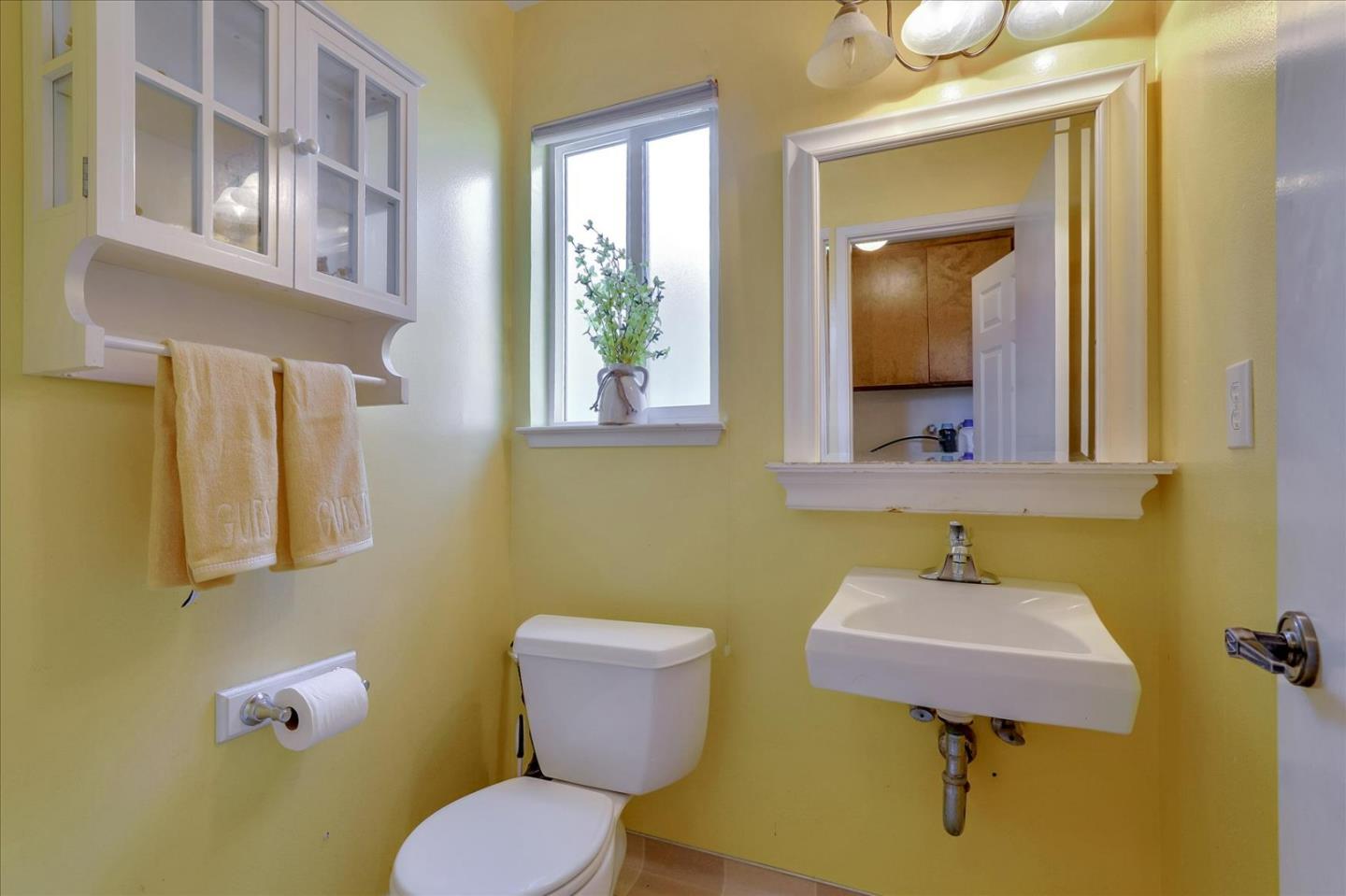 7166 Brooktree Way San Jose, CA 95120 - Photo 30 of 48 a bathroom with a sink mirror and toilet