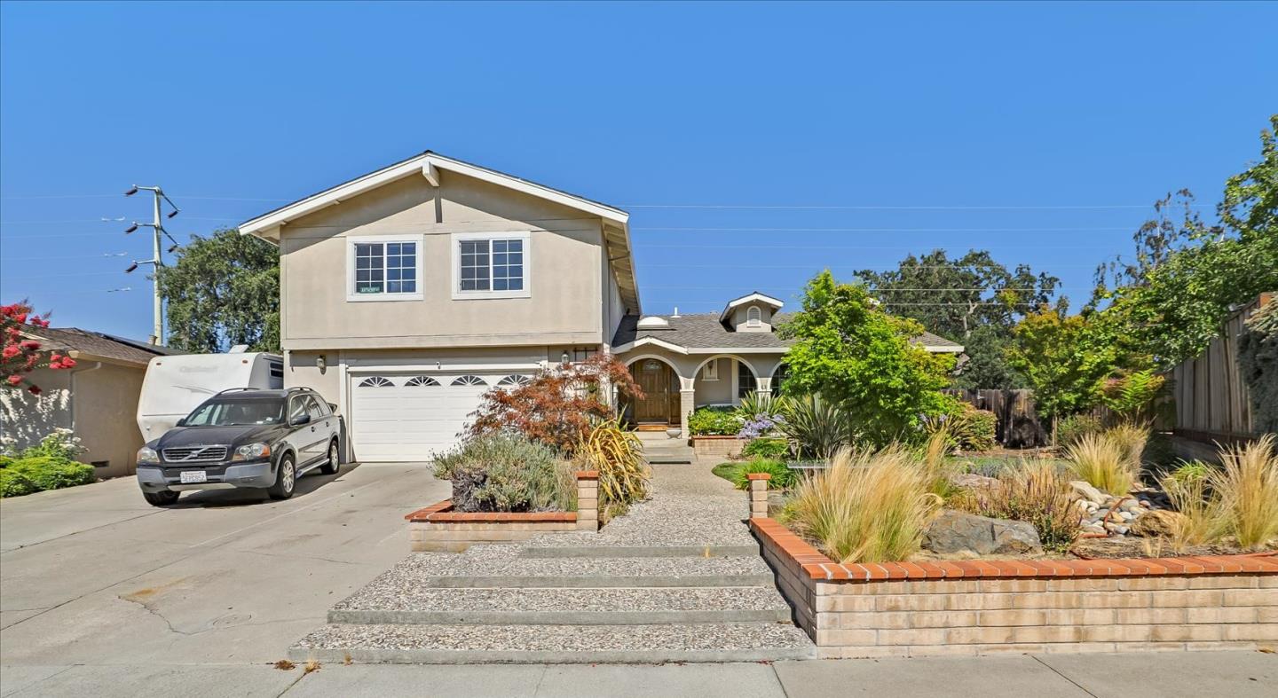 7166 Brooktree Way San Jose, CA 95120 - Photo 3 of 48 a view of a house with a yard