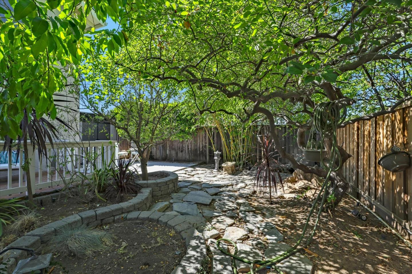 7166 Brooktree Way San Jose, CA 95120 - Photo 35 of 48 a backyard of a house with lots of green space and tree