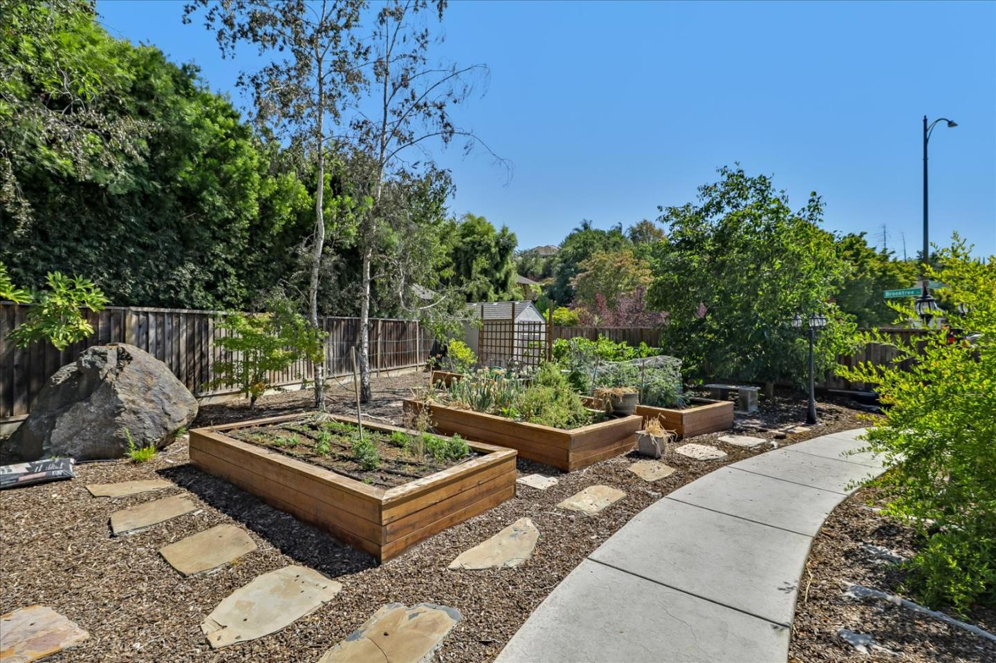 7166 Brooktree Way San Jose, CA 95120 - Photo 40 of 48 a view of a backyard with sitting area