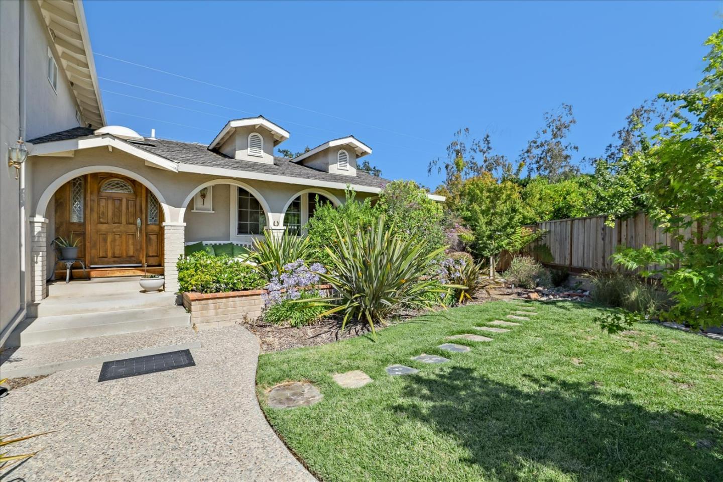 7166 Brooktree Way San Jose, CA 95120 - Photo 4 of 48 a front view of a house with a yard