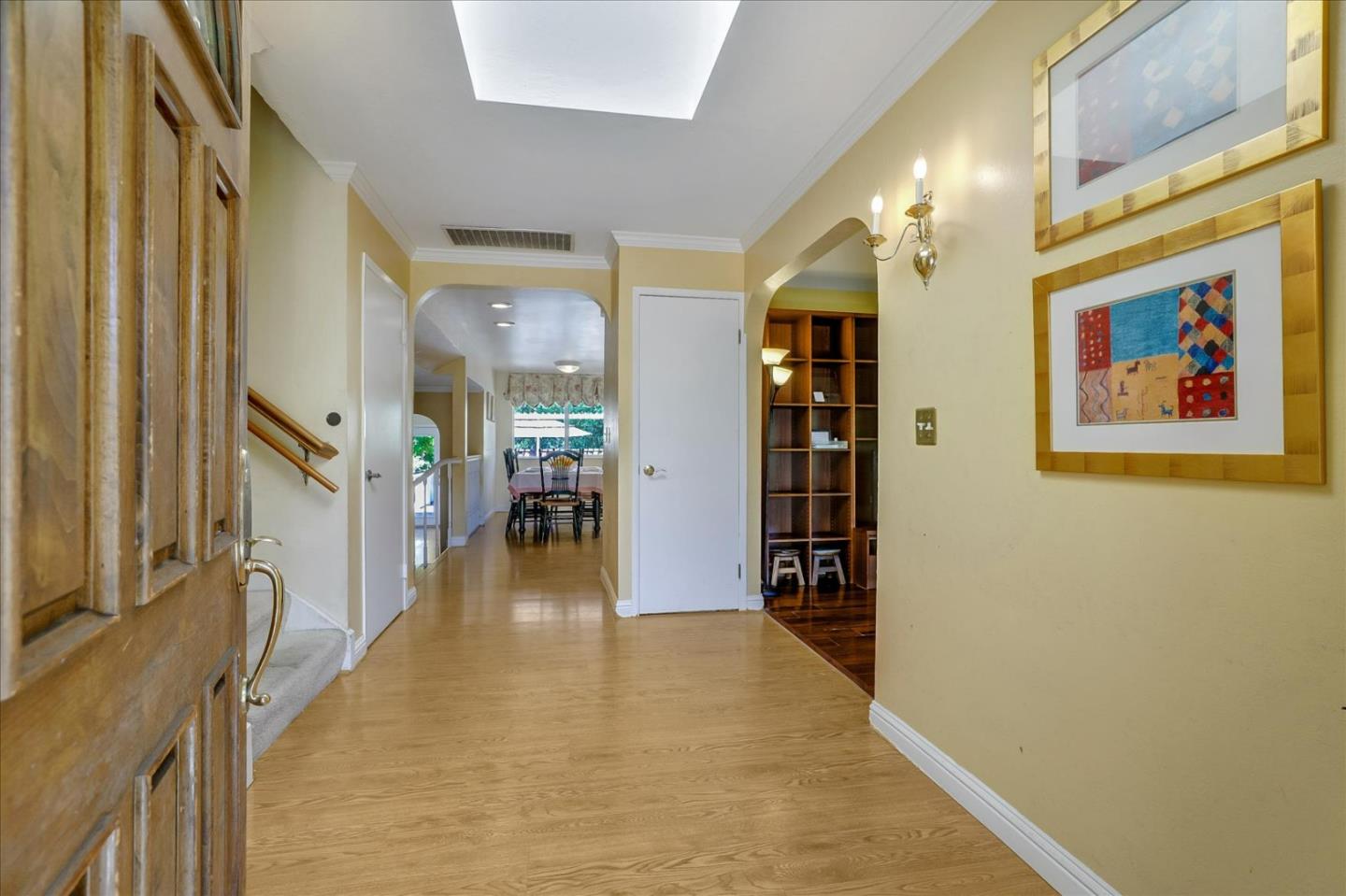 7166 Brooktree Way San Jose, CA 95120 - Photo 5 of 48 a view of a hallway with wooden floor and staircase