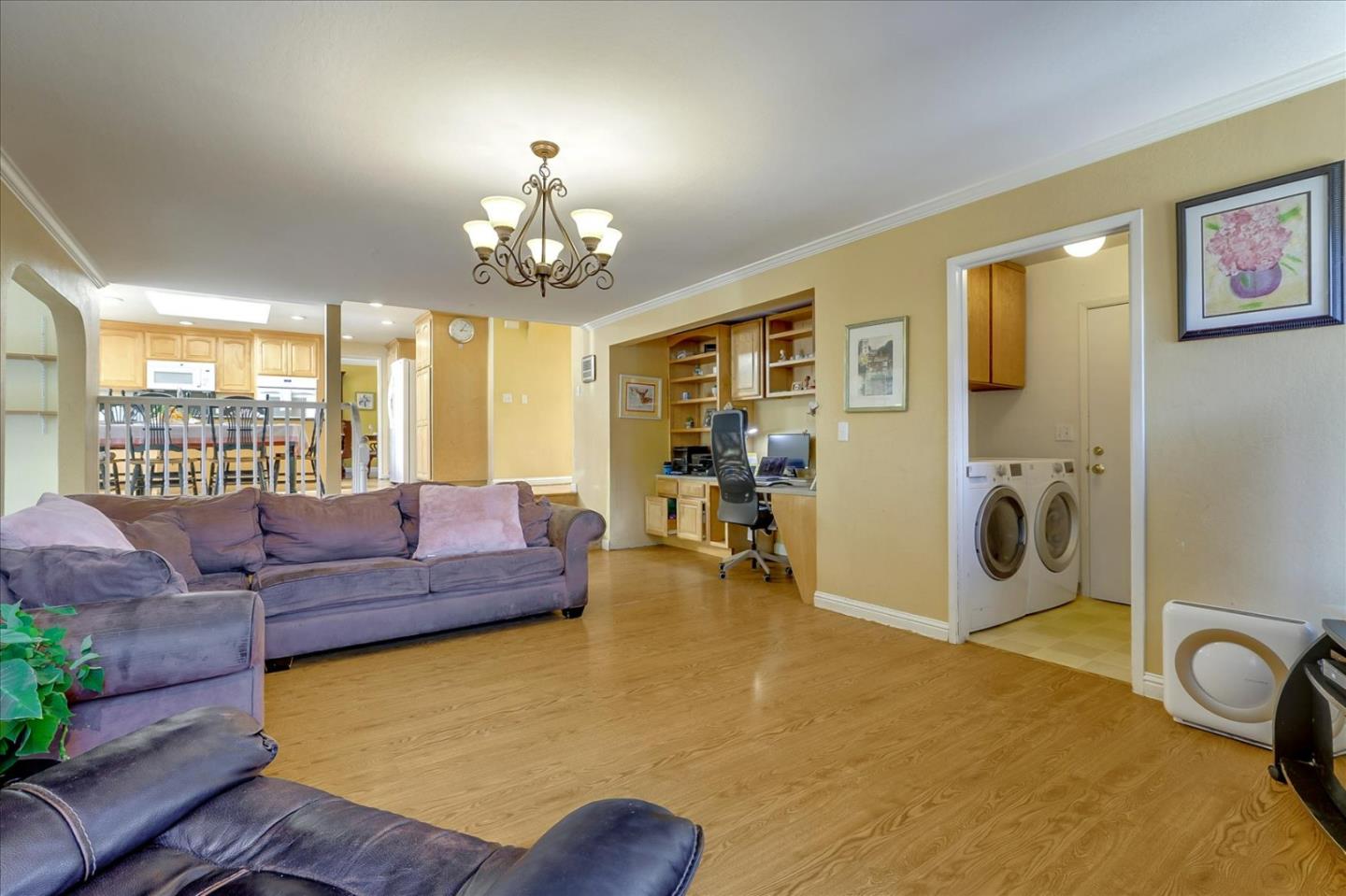 7166 Brooktree Way San Jose, CA 95120 - Photo 7 of 48 a living room with furniture and a chandelier