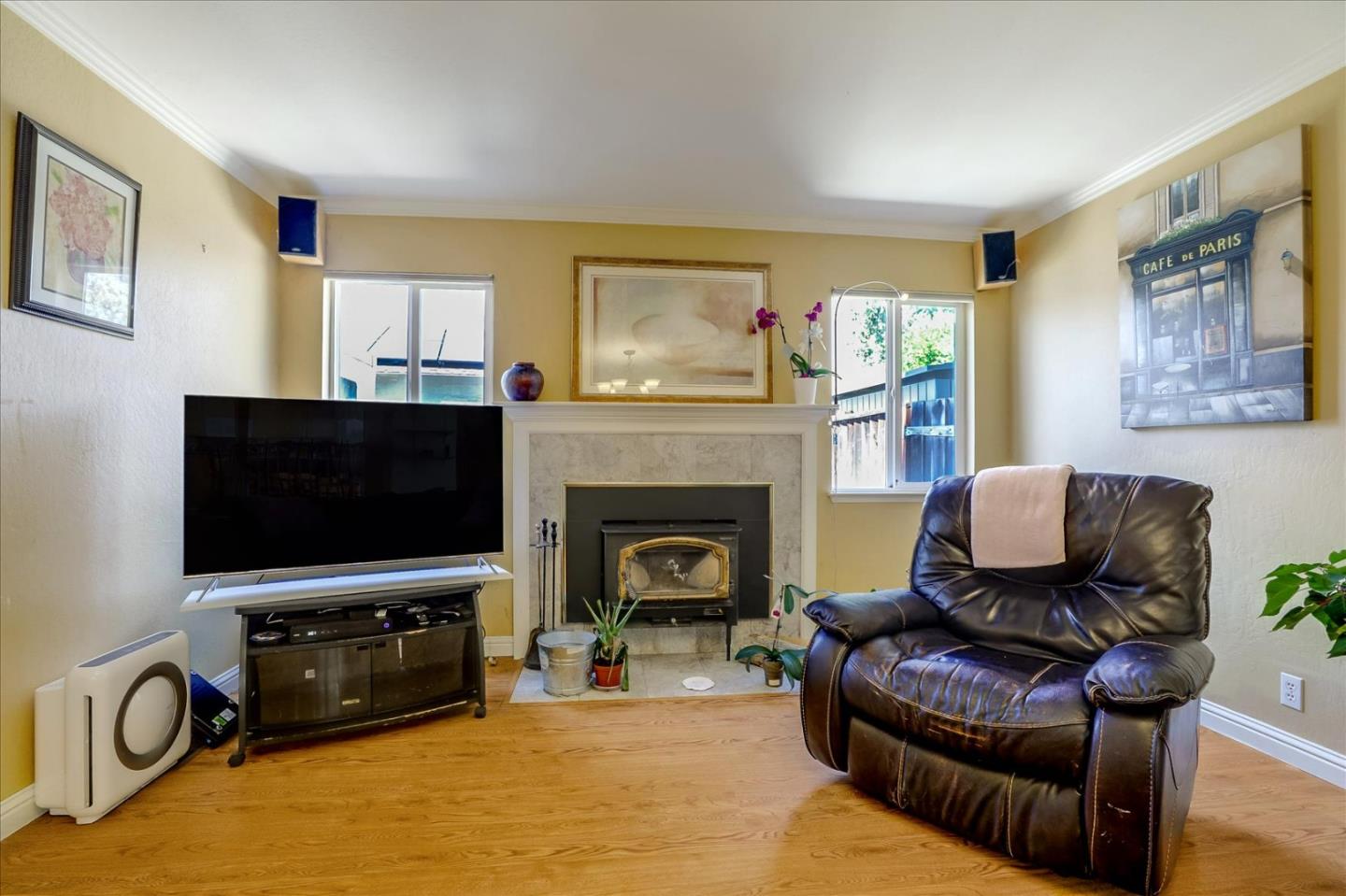 7166 Brooktree Way San Jose, CA 95120 - Photo 8 of 48 a living room with furniture a flat screen tv and a fireplace
