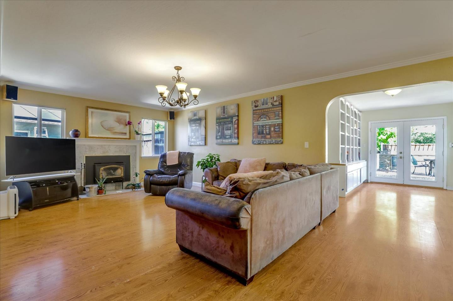 7166 Brooktree Way San Jose, CA 95120 - Photo 9 of 48 a living room with furniture a fireplace and a flat screen tv