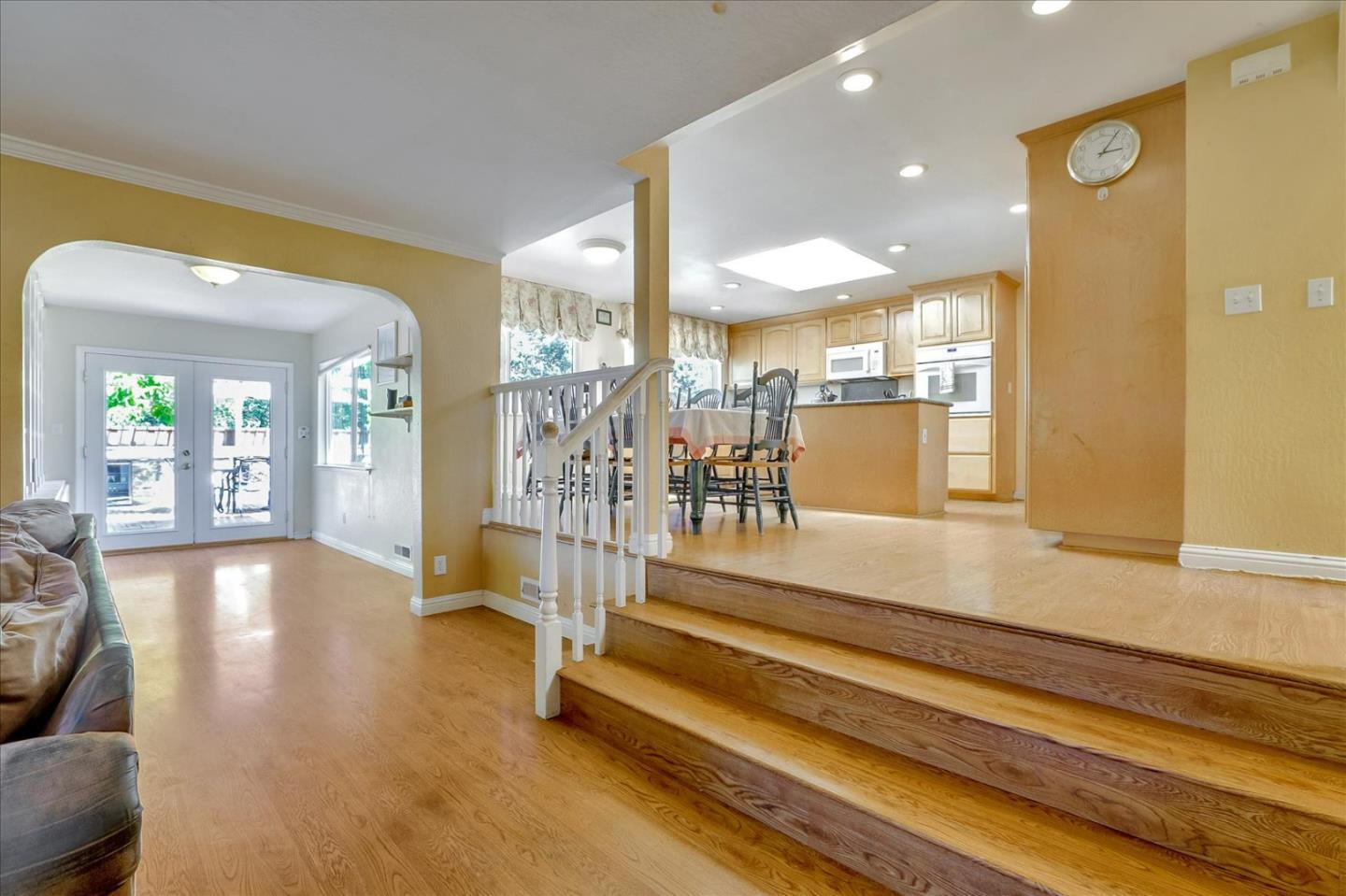 7166 Brooktree Way San Jose, CA 95120 - Photo 10 of 48 a view of an entryway with wooden floor and windows