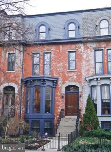 a front view of a building with balcony