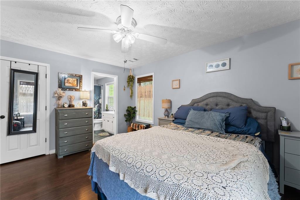 3615 South Bend Road Gainesville, GA 30506 - Photo 9 of 54 a bedroom with a bed and wooden floor