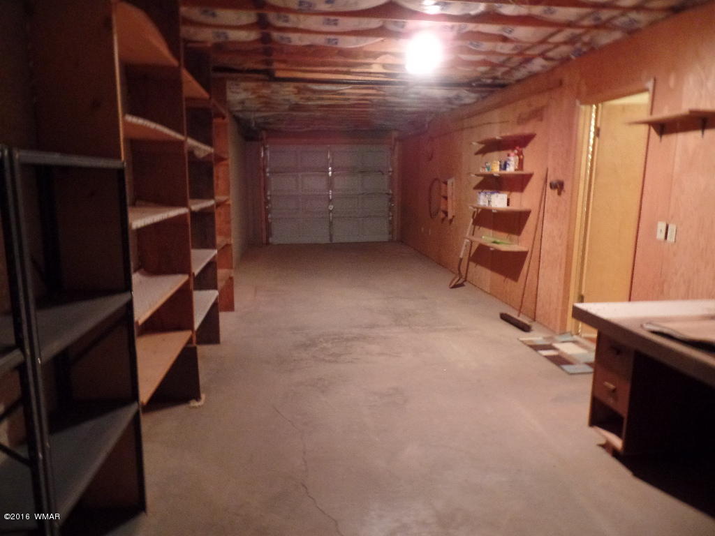 1124 North 650 Street Snowflake, AZ 85937 - Photo 32 of 35 a view of walk in closet with clothes and shoes