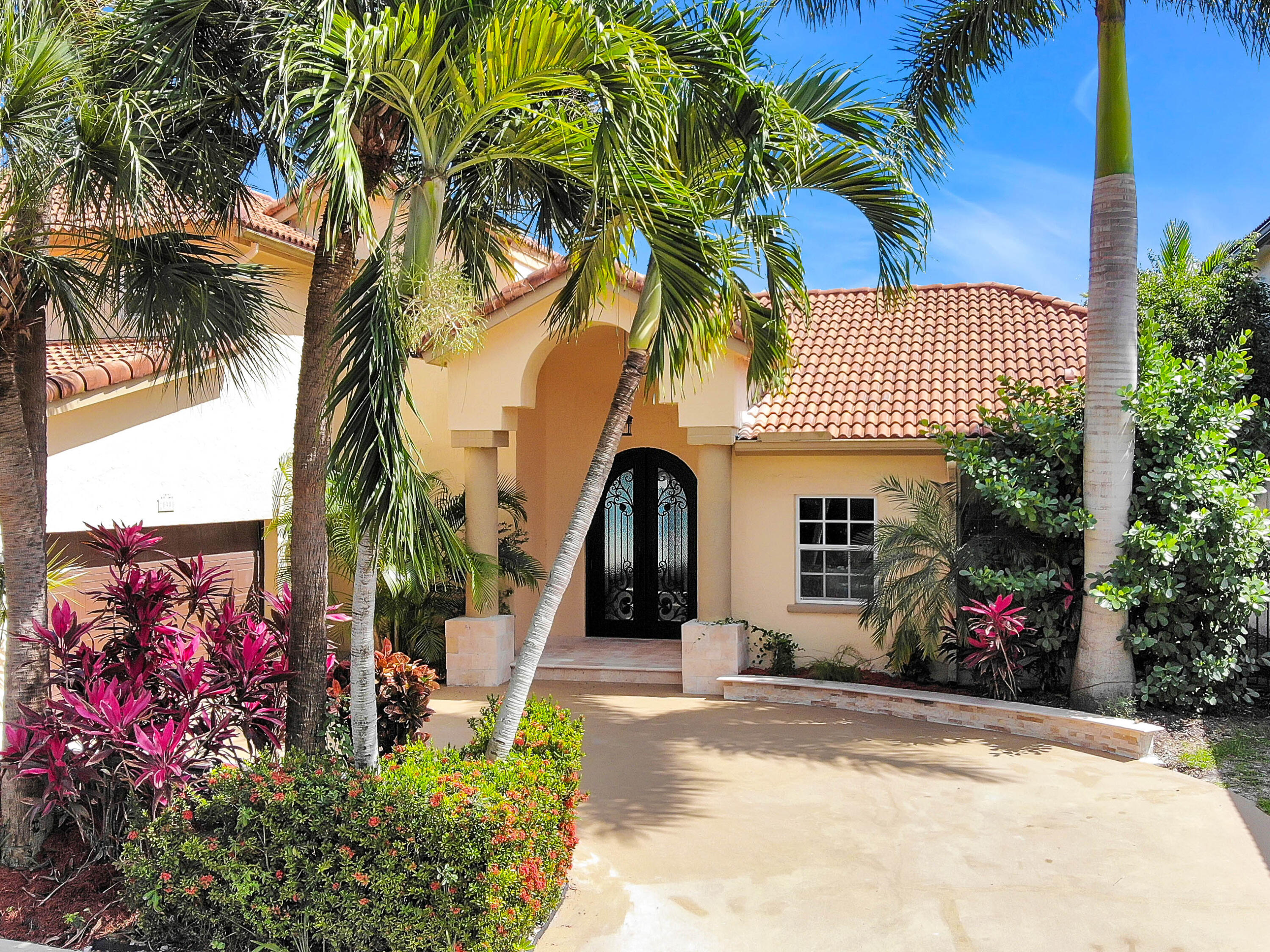 10900 Haydn Drive Boca Raton, FL 33498 - Photo 2 of 55 FRONT, DRIVE-WAY, 2-CAR GARAGE