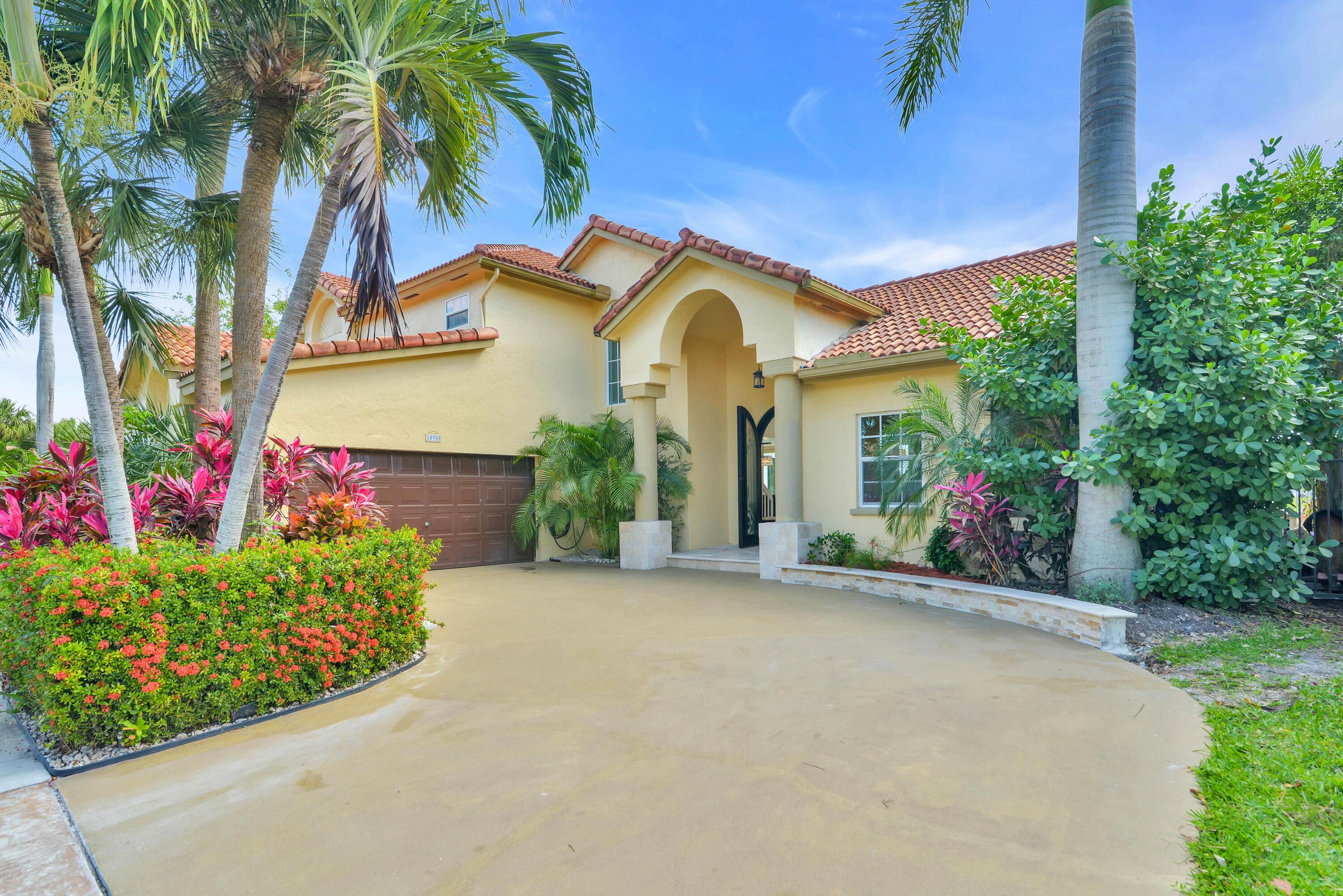 10900 Haydn Drive Boca Raton, FL 33498 - Photo 4 of 55 DRIVE-WAY AND TWO-CAR GARAGE