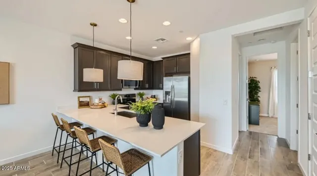 a kitchen with a stove a sink and a microwave