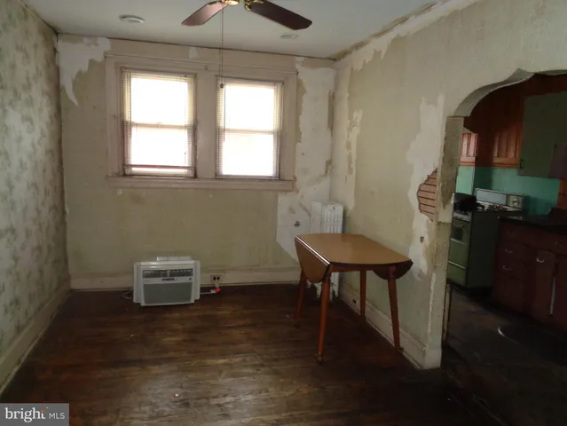 a kitchen with a sink cabinets and a window