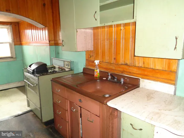 a room with cabinets and a fireplace