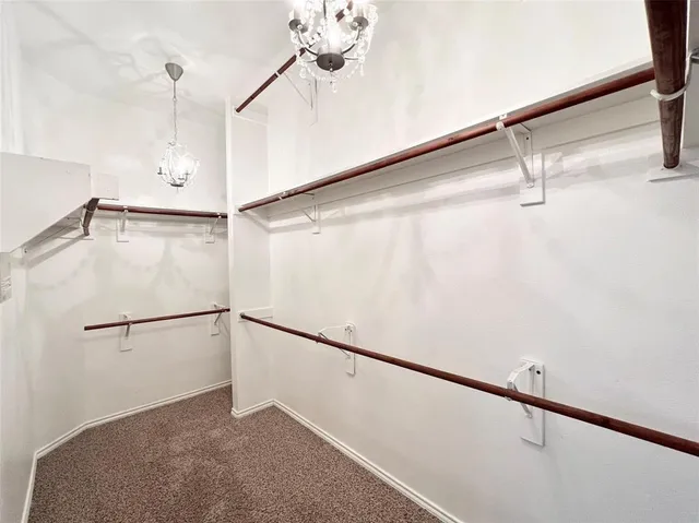 a bathroom with a sink a shower a mirror and a shower