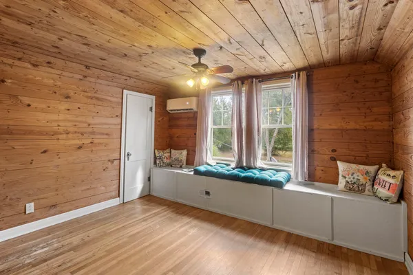 a view of an entryway with wooden floor