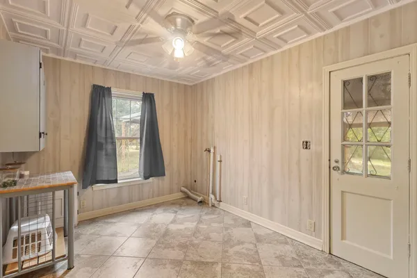 a view of a house with backyard and porch