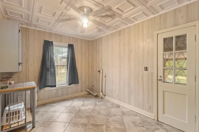 a view of a house with backyard and porch