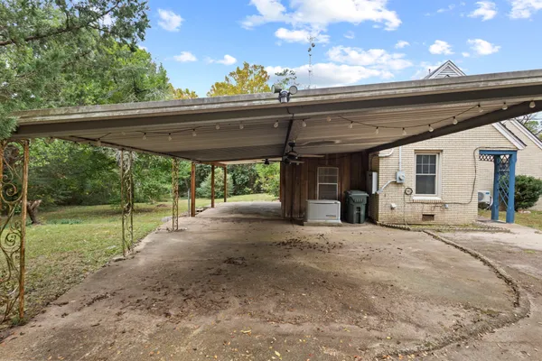a view of a room with gym equipment and a large window